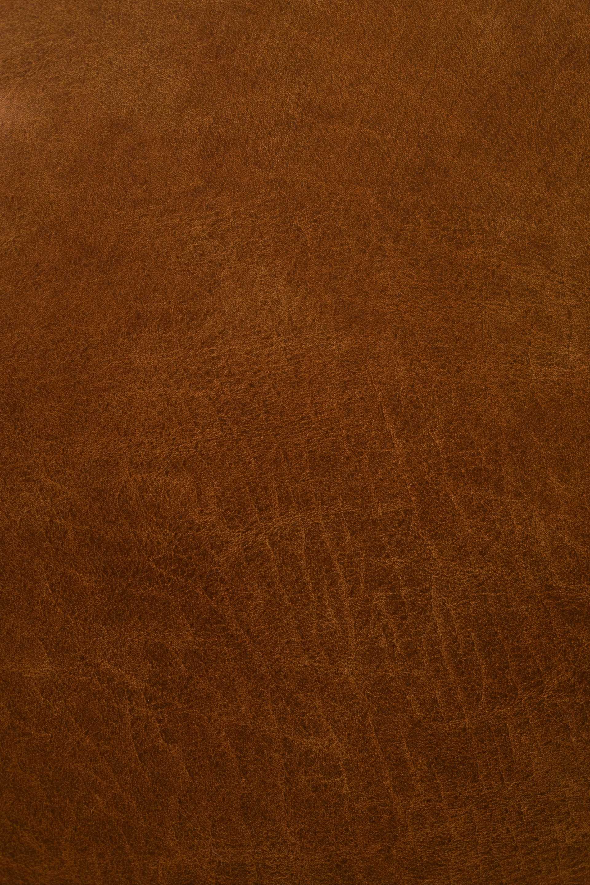 Textured brown leather surface with natural grain patterns.